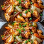 Kip roerbak met gouden sojasaus, knoflook en lente groenten op een bord.