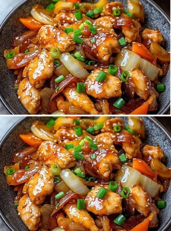 Kip roerbak met gouden sojasaus, knoflook en lente groenten op een bord.